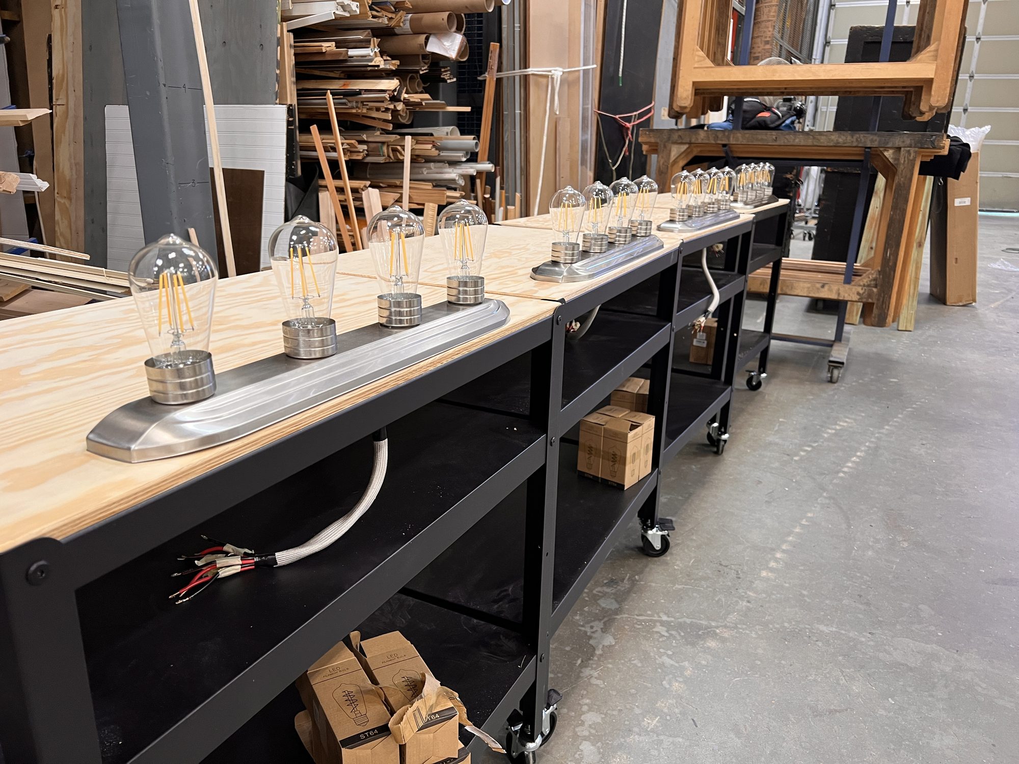 Custom 12V four-bulb bars, wired to the battery and dimmers under the cart top