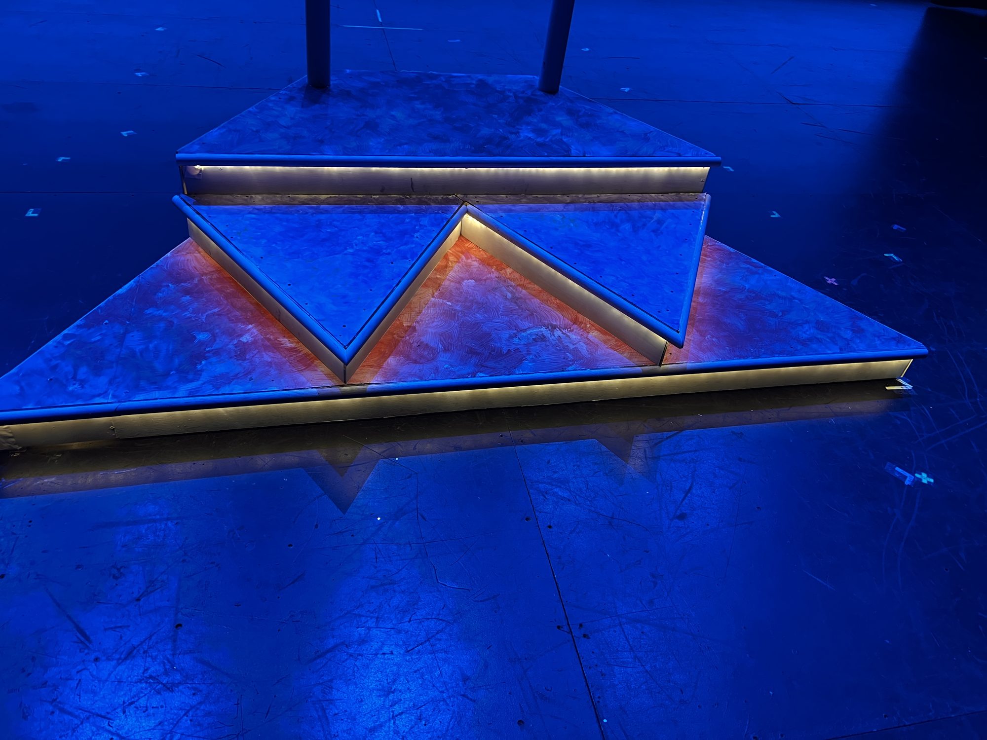 Lit stair unit built for Aisle Be Damned, onstage under blue light